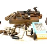 Large selection of vintage tools includes wood workers planes, drill bits, hand held drill etc