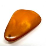 Egg yolk baltic amber pendant measures approx 5.5cm drop by 3.2cm weight 11g