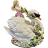 Antique porcelain swan and cherub ornament, with flowers, leaves and fruit, this piece is damaged as