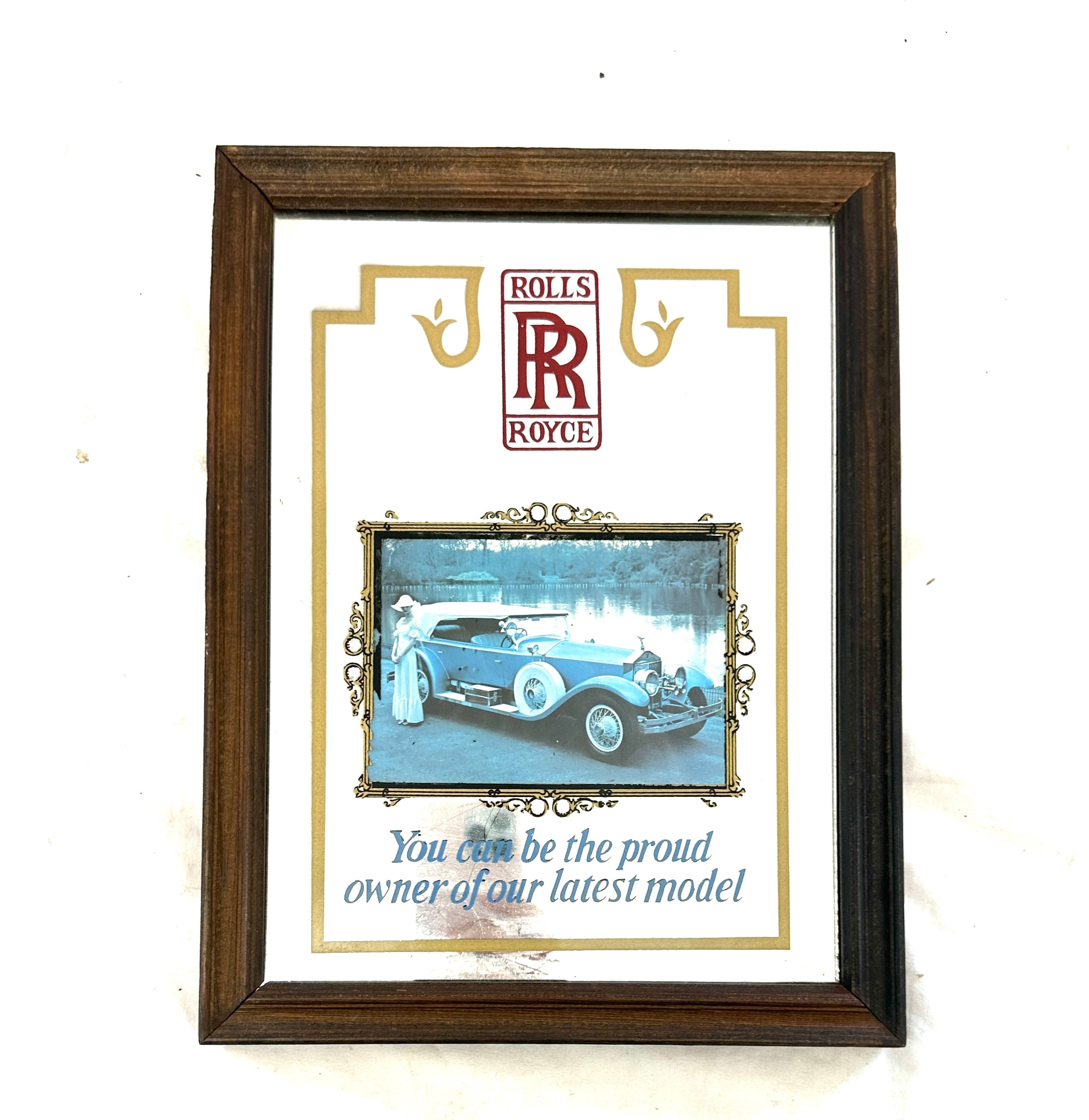 Framed advertising Rolls mirror, measures approximately 13.5 inches by 10 inches