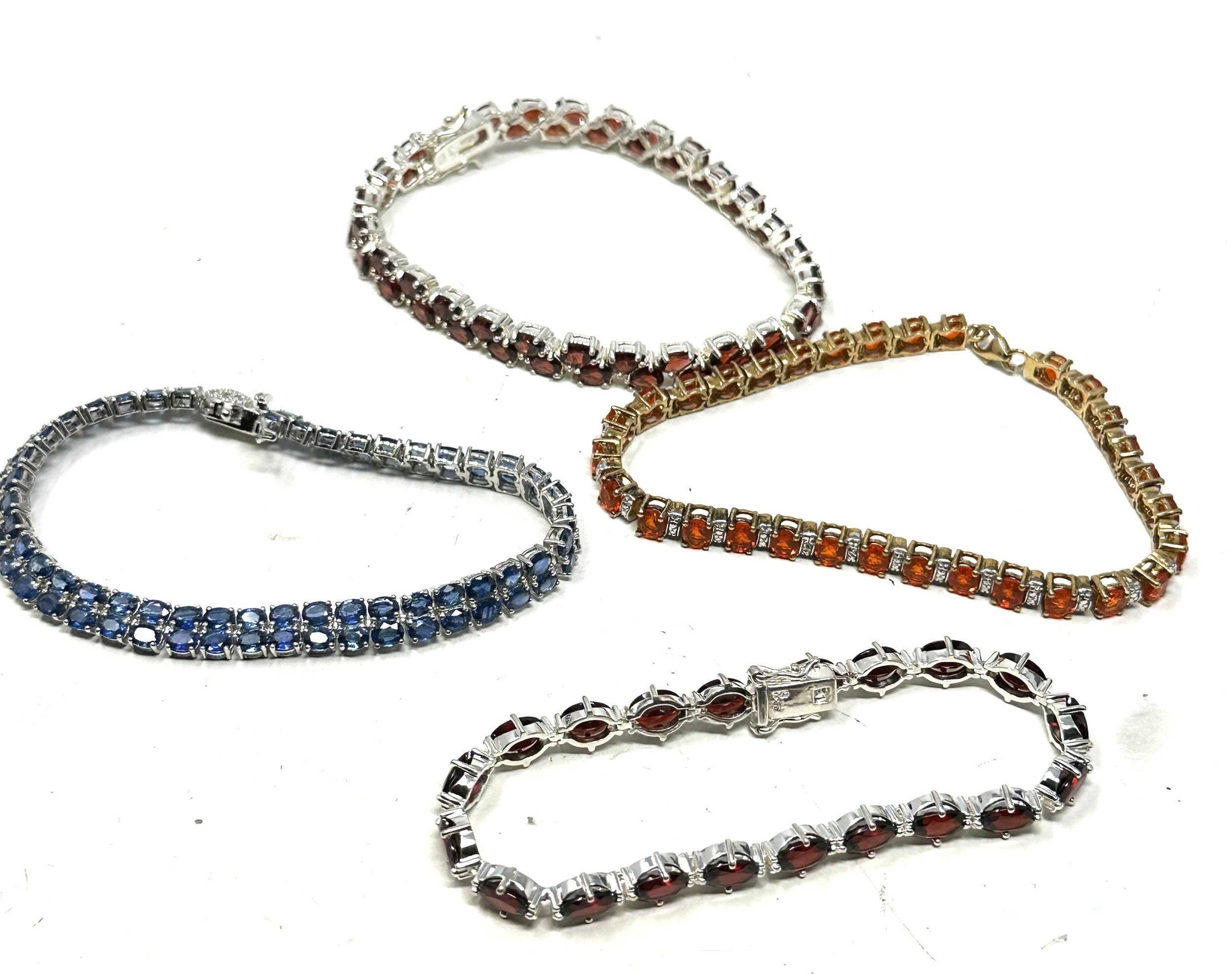 4 X .925 Tennis Style Bracelets Including Tanzanite (64g)