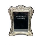 silver picture frame measures approx 23cm by 19cm