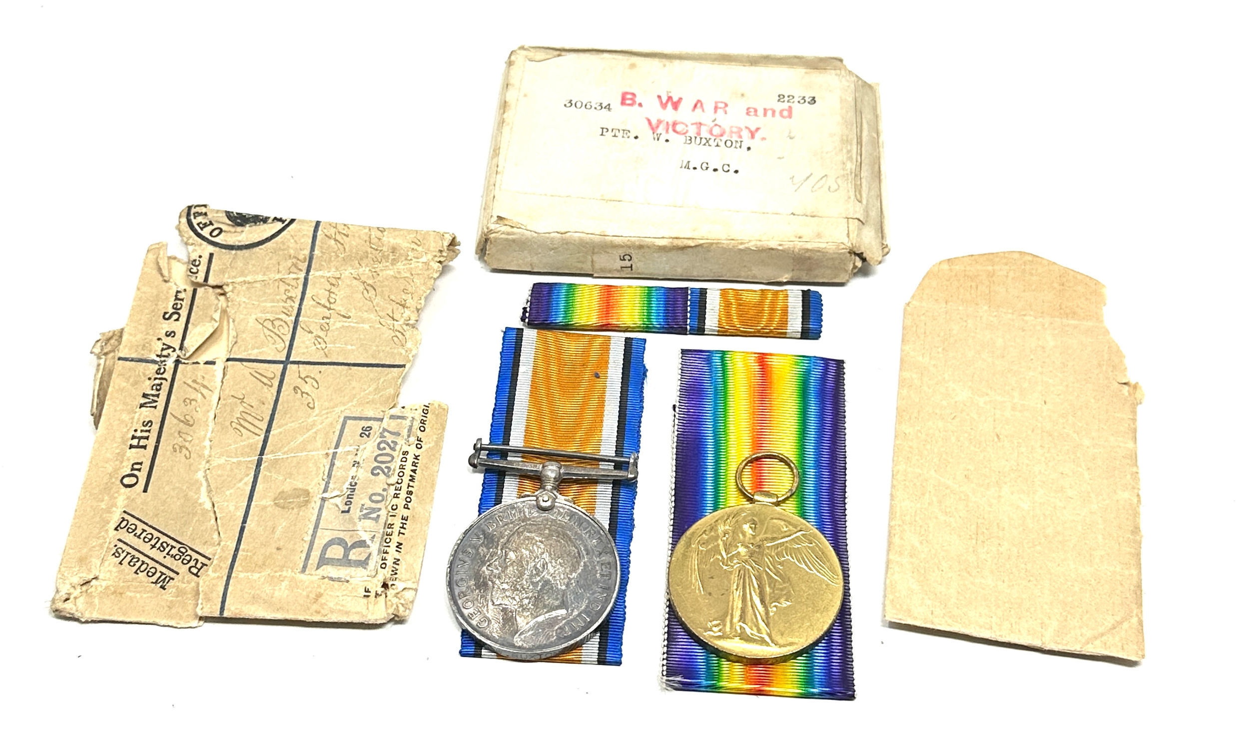 boxed ww1 medal pair to 30634 pte w.buxton M.G.C