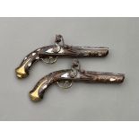 Two Antique Ottoman silver & mother pf pearl flintlock pistols 19th century approx length 30cm