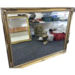 Large beveled edge gilt framed mirror measures approximately 128cm wide 116cm tall