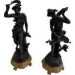 Pair of decorative figures on a base 17 inches tall