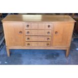 Russels of broadway 2 door 4 draw sideboard measures approximately 34 inches tall 55 inches long