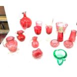 Large selection of assorted cranberry glassware includes glasses, sugar shaker etc