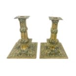 Pair of heavy ornate brass candlesticks, probably Victorian, approximate height 17cm