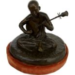 Bronze figure of a boy playing the Mandolin on a detachable fabric base, marked Fonderi Tonknoise