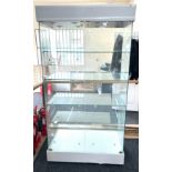 2 Door glass display cabinet with 4 glass shelves, new locks required, lighting to top,