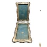 2 antique silver picture frames measure 16cm by 12cm 1 missing back easel