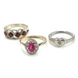 3 Ladies stone set rings includes a silver diamond set heart ring, silver garnet set ring and a
