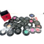 Large selection of 45s in a case includes The Who, Elvis Presley etc