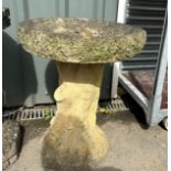 Concrete tree trunk style bird bath