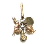 Selection of gold/ gold coloured charms includes tea pot, rabbit and a deer