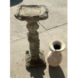 Two concrete garden ornaments in need of repair largest measures 30 inches tall