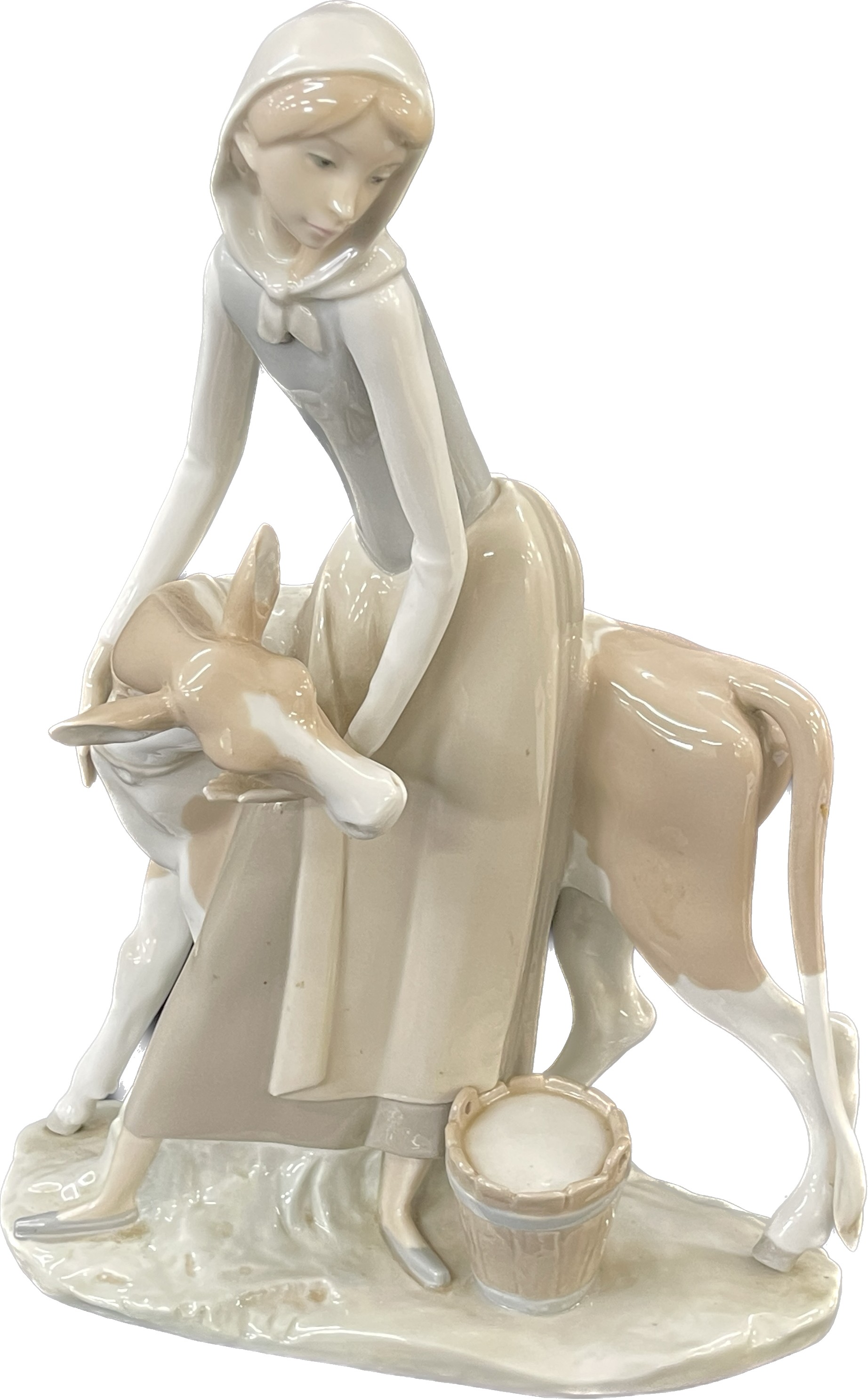 Lladro Porcelain Farmer Girl Miling Cow measures approximately 13 inches tall