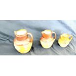 3 Royal Doulton graduating stone ware jugs