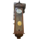 Weighted 1 key hole mahogany wall clock with pendelum no key measures approx 48 inches tall