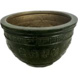 Large green jardiniere with dragon design measures approximatelyHeight 10 inches, diameter 14