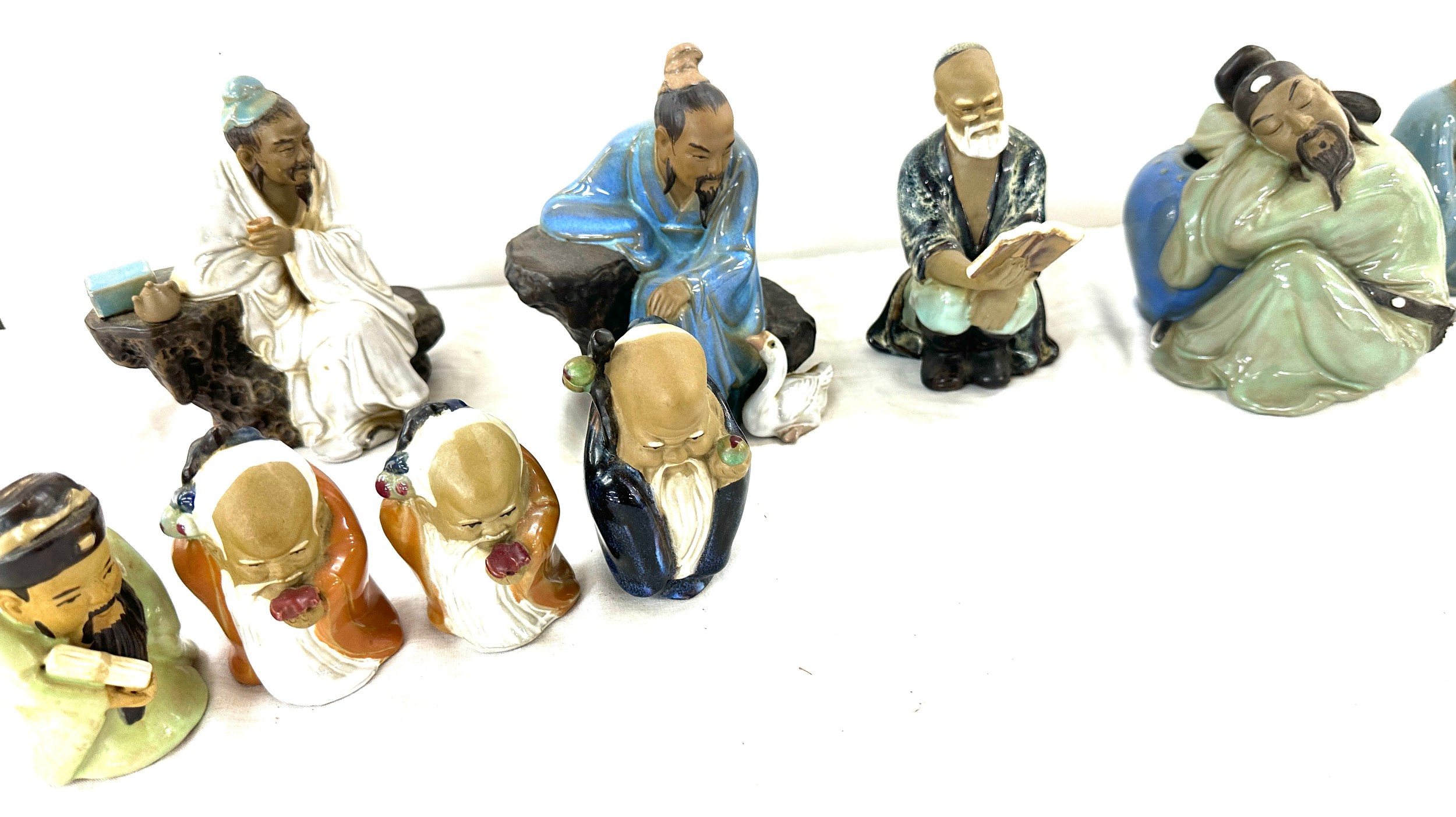 Selection of Japanese mud men figures, marks to the base - Image 3 of 5