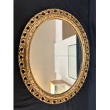 Guilt framed oval mirror measures approx 23 inches wide by 19 inches long