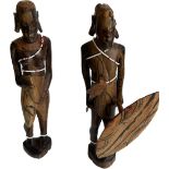 Pair of Masai wood carvings male and female measures A/F approx 12 inches tall
