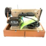 Singer portable electric sewing machine, no 201k in carrying case with foot peddle and some