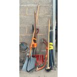 Large selection of assorted garden tools includes drain rods, spades, saws etc