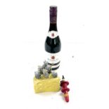 Novelty cheese knife set, bottle stopper and a bottle of Wine