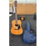 Acoustic fender guitar with padded case, stand not included