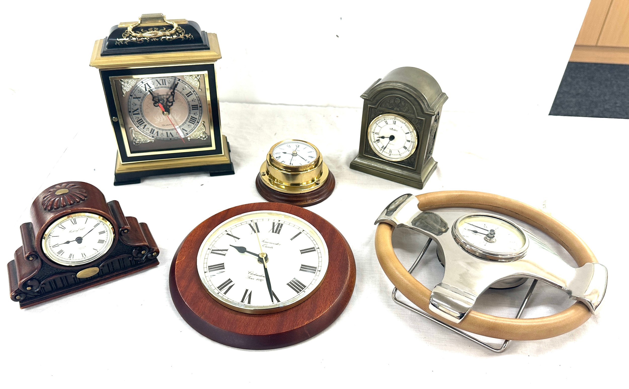 Selection of battery operated clocks to include wall hanging, mantel clocks etc, all untested