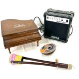 Selection of musical instruments includes baby piano, wooden hand painted instruments, amp etc