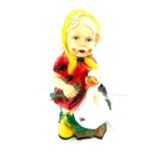 Plastic garden figure of a young girl and a goose, height approximately 19 inches