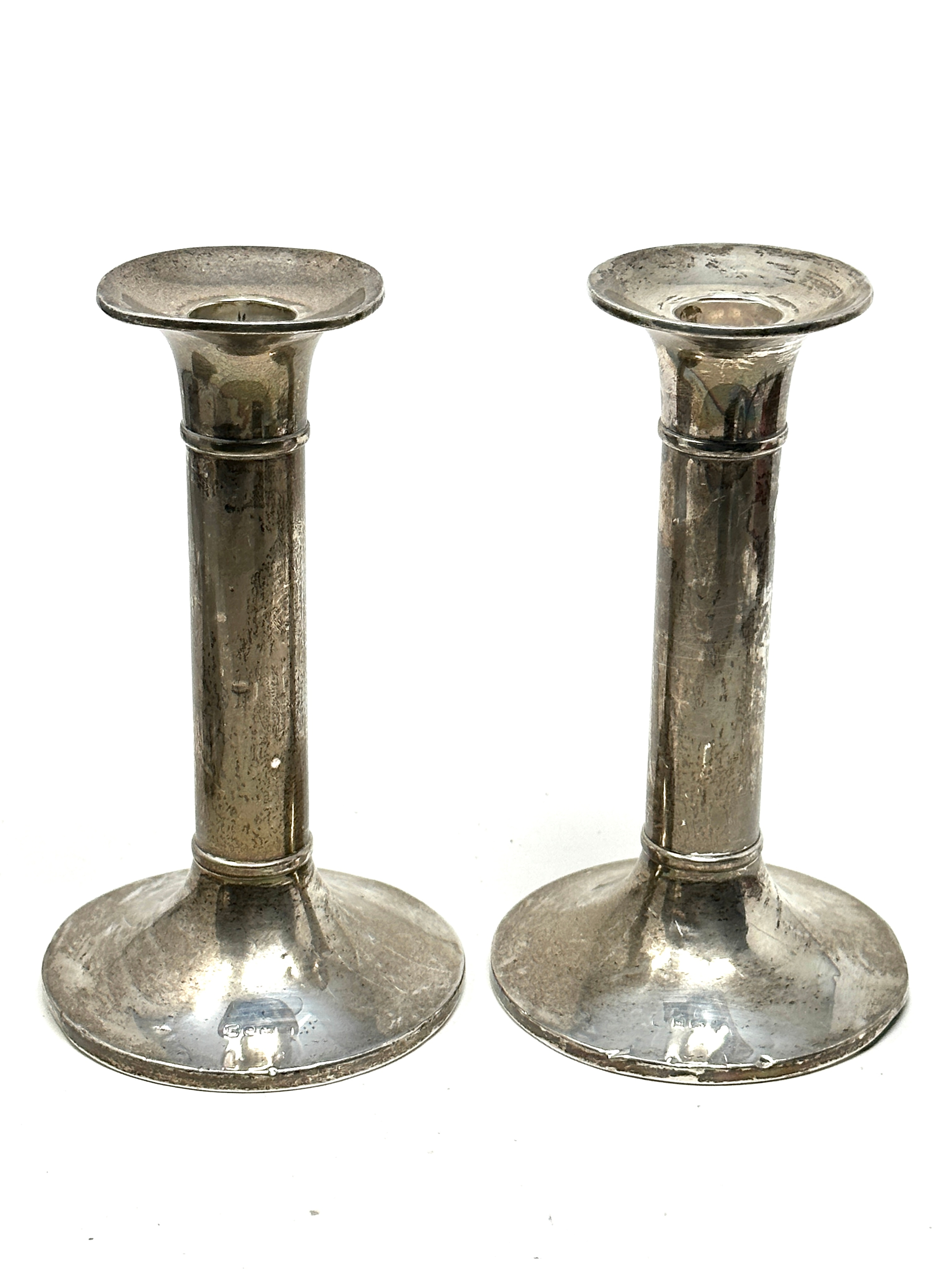 Pair of silver candlesticks measure approx height 15.5cm