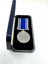 Boxed ER11 police long service medal to serg Patricia a scally