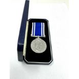 Boxed ER11 police long service medal to serg Patricia a scally