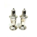 pair of sterling silver pepper pots glass liners measure approx 11cm tall