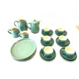 Selection of Denby pottery includes tea pot, plates, cups, milk jug