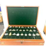 Wooden brass bound box with assorted Army badges