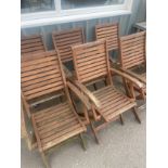 Set of six teak folding garden chairs