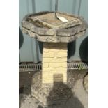 Concrete sun dial bird bath