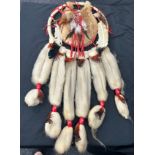 Large Native American dream catcher, made with animal fur, measures approximately 31inches by 13