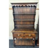 2 Drawer oak dresser with pot board measures approximately 72 inches tall 39 inches wide 17 inches