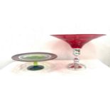 Large red glass center piece with a silver plated stand and a studio glass cake stand