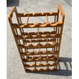 Pine wine rack, measures approximately 38 inches tall 19inches wide 11 inches depth