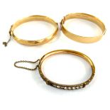 Three rolled gold vintage bangles