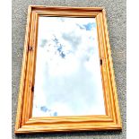 Large pine framed mirror, approximate measurements: 36 x 24 inches