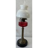 Vintage brass column base cranberry oil lamp with shade and funnel 29 inches tall